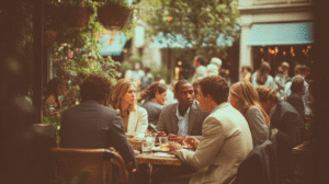 diverse group of relaxed business people talking together at outdoor cafe