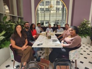 SBC MA event on Thursday 14 May. table with 8 people facing the camera in a beautiful setting