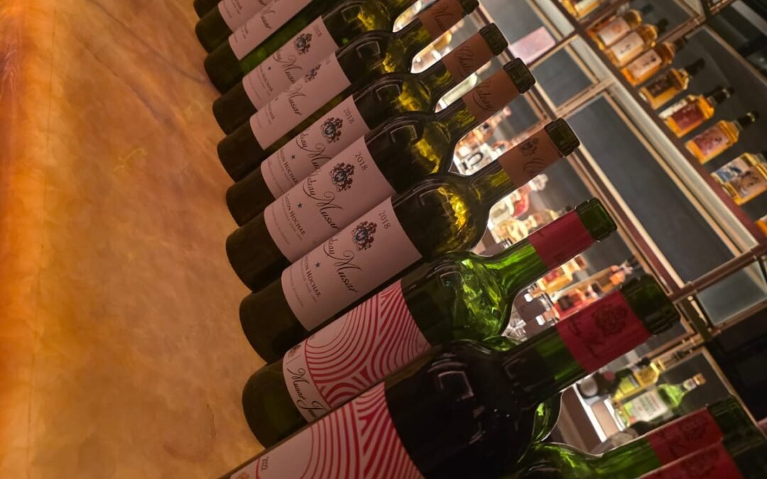 row of chateu musar bottles of wine lined up to serve dinner guests