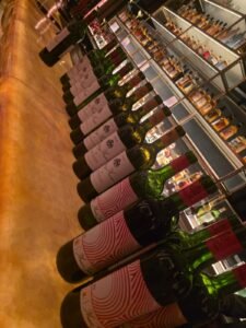 row of chateu musar bottles of wine lined up to serve dinner guests